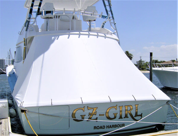 aft cockpit cover with stainless securing pins on light blue hull sport fish boat