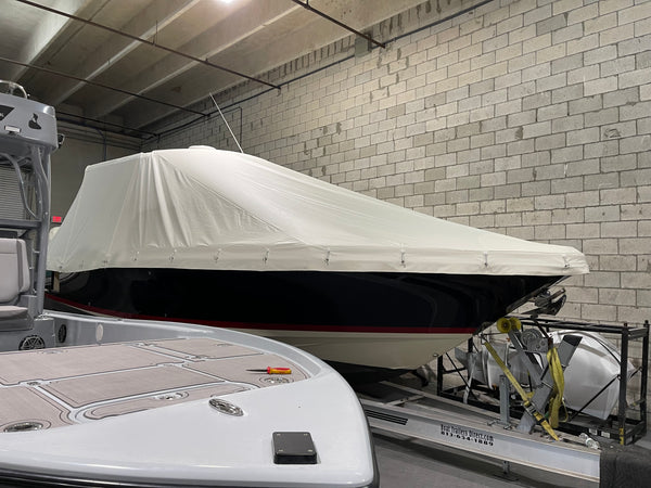 boat cover in white stamoid on center console bow view