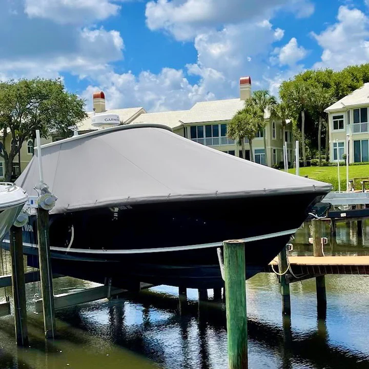 boat cover in gray weathermax on center console bow view trees