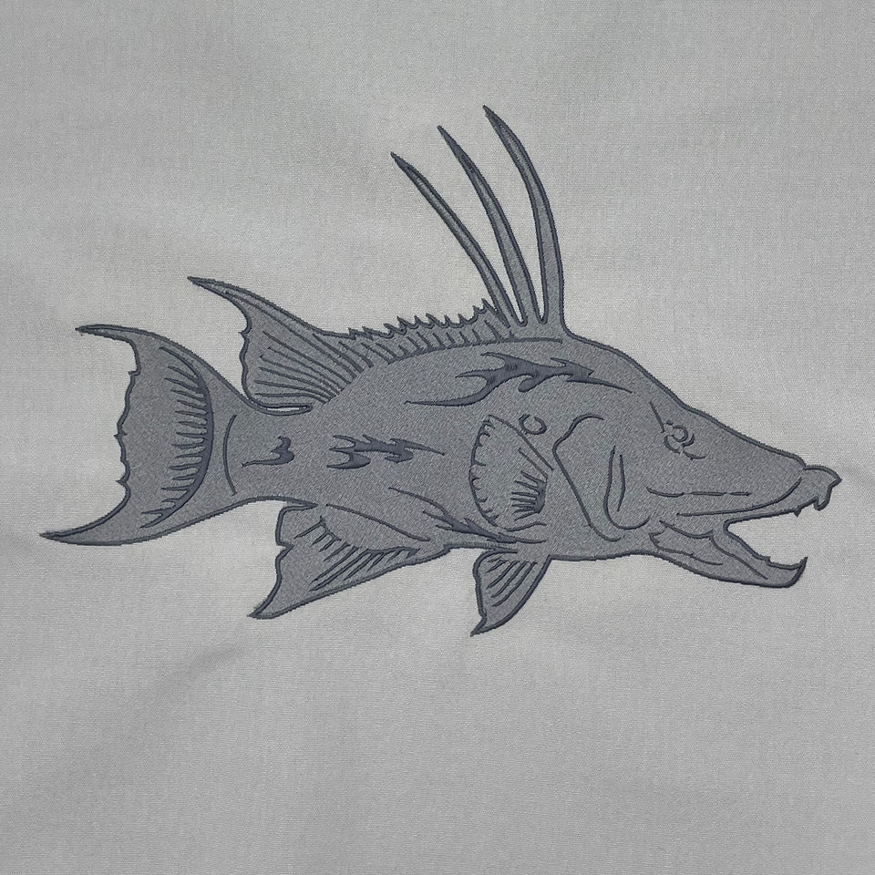 Gray hogfish embroidered in tonal thread on light fabric