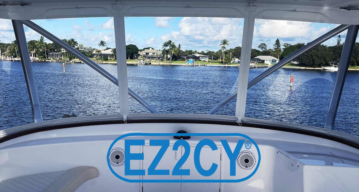 View through clear EZ2CY enclosure panels toward blue water and waterfront homes