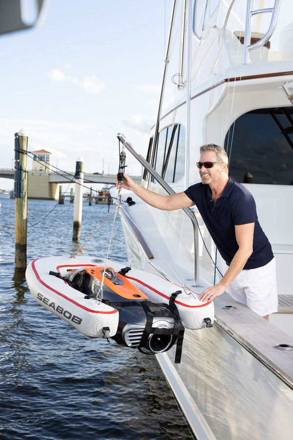 seabob lifting pole with guy on sportfish boat