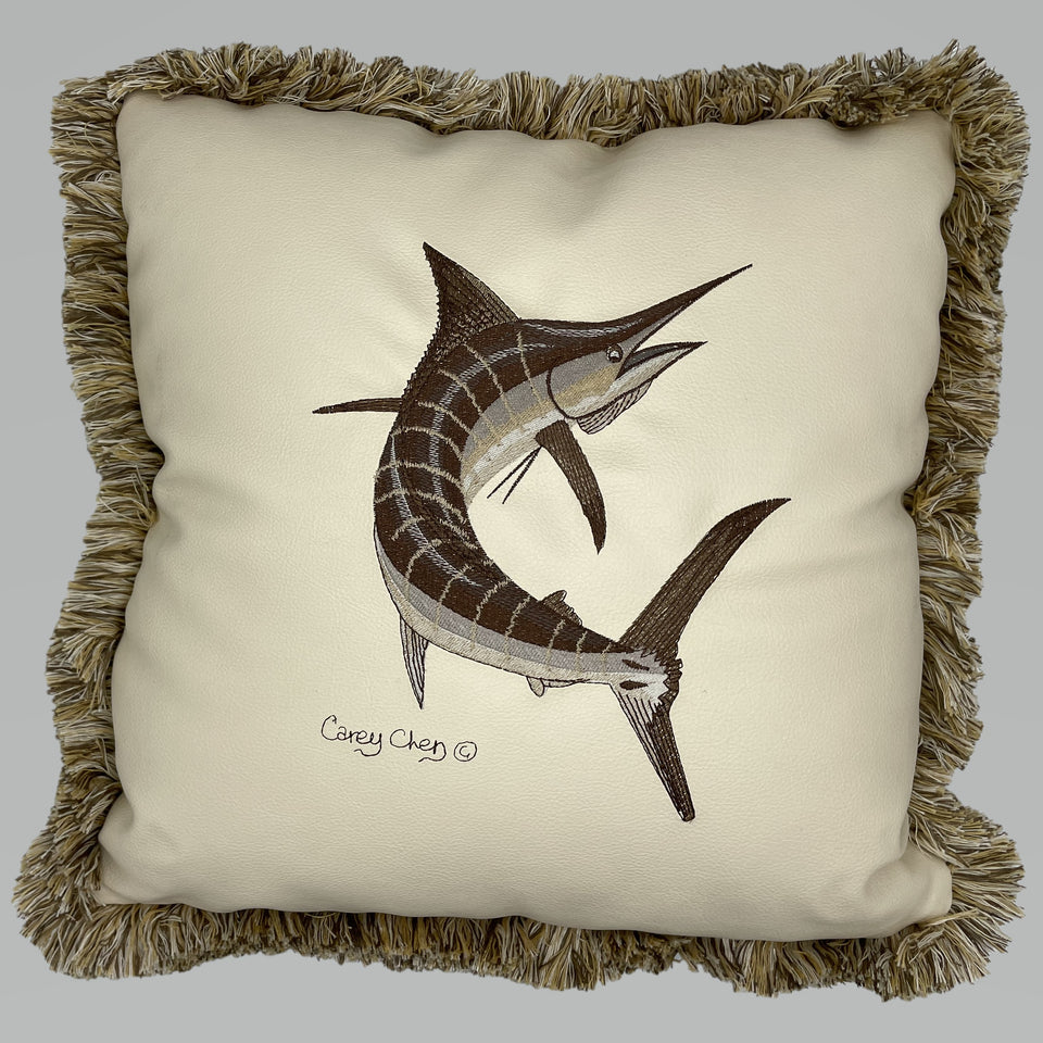 Cream fringed pillow with embroidered marlin artwork by Carey Chen
