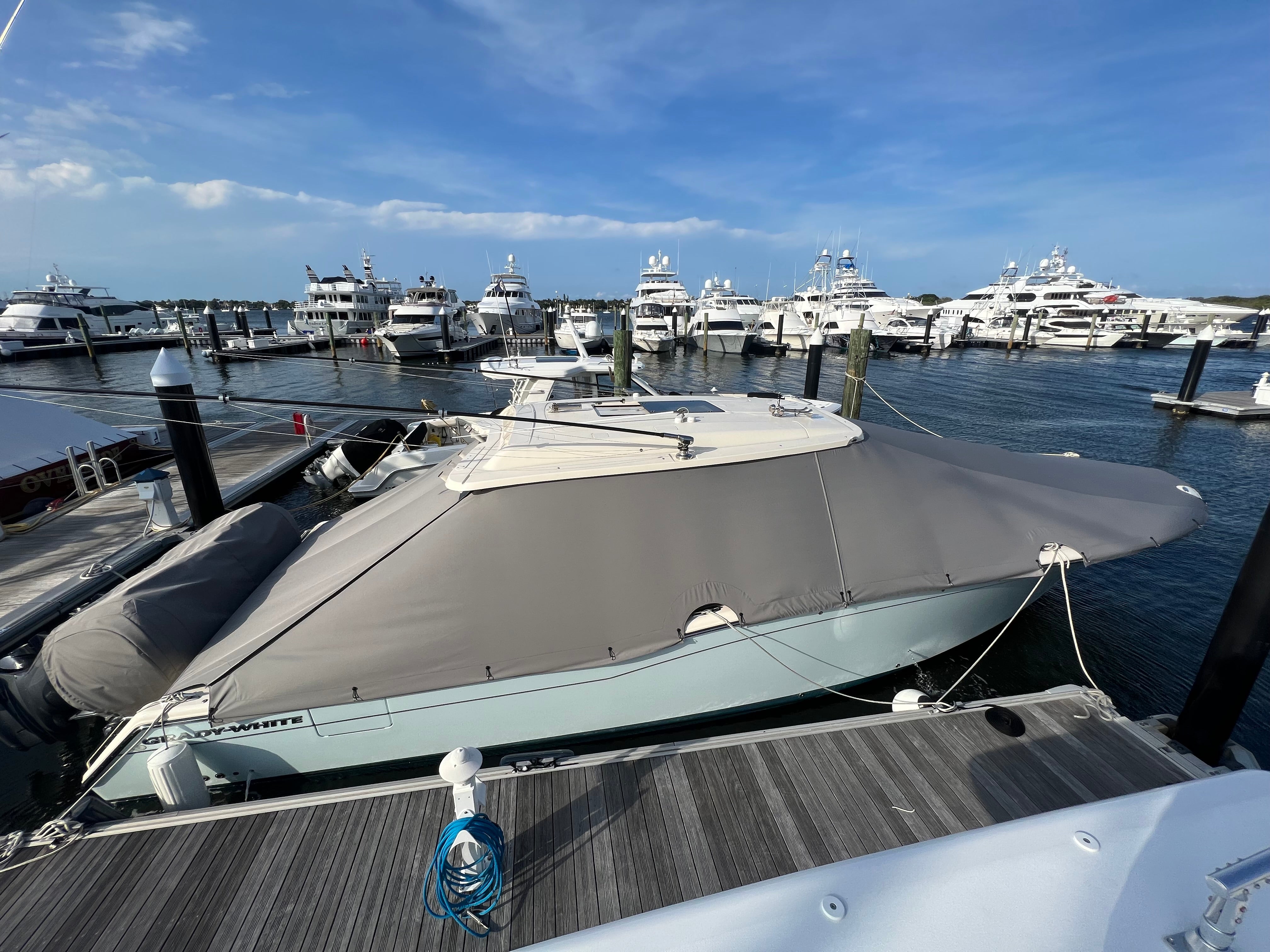 gradade pins on gray weather max boat cover yachts in back
