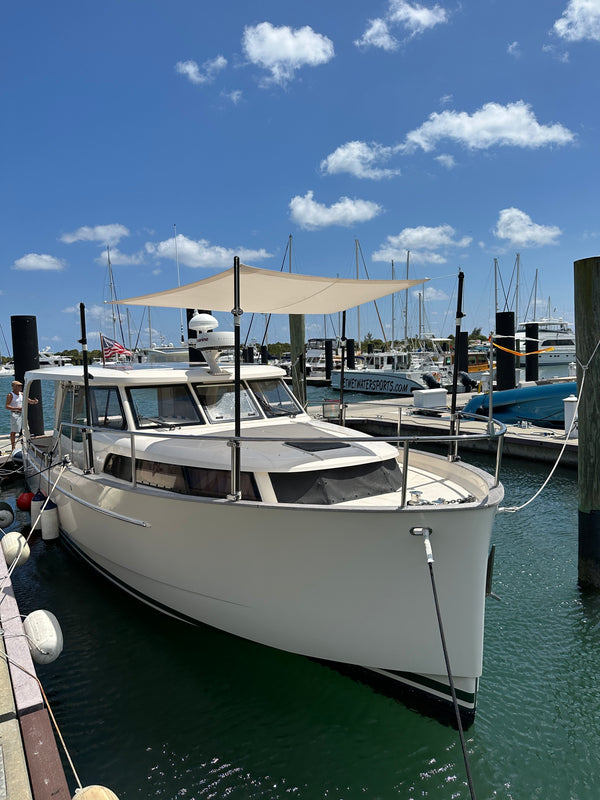 sunfly shade poles on small boat on bow