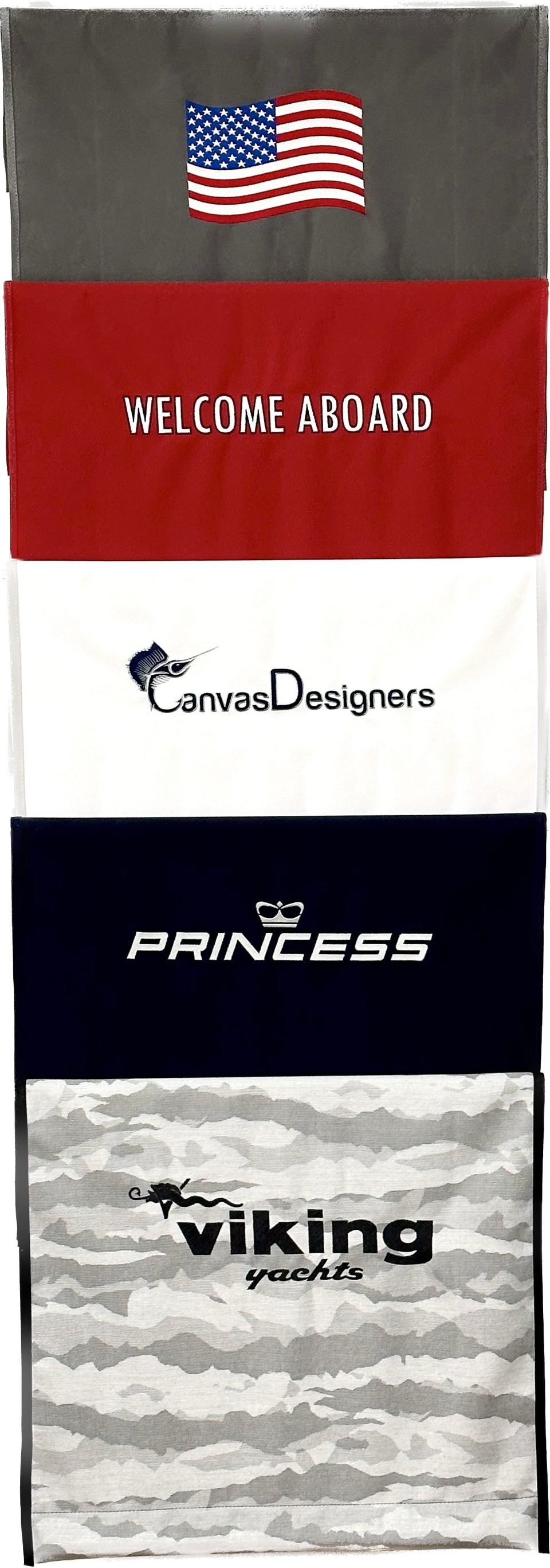 Vertical display of boarding mats with flags, boat branding and welcome messages