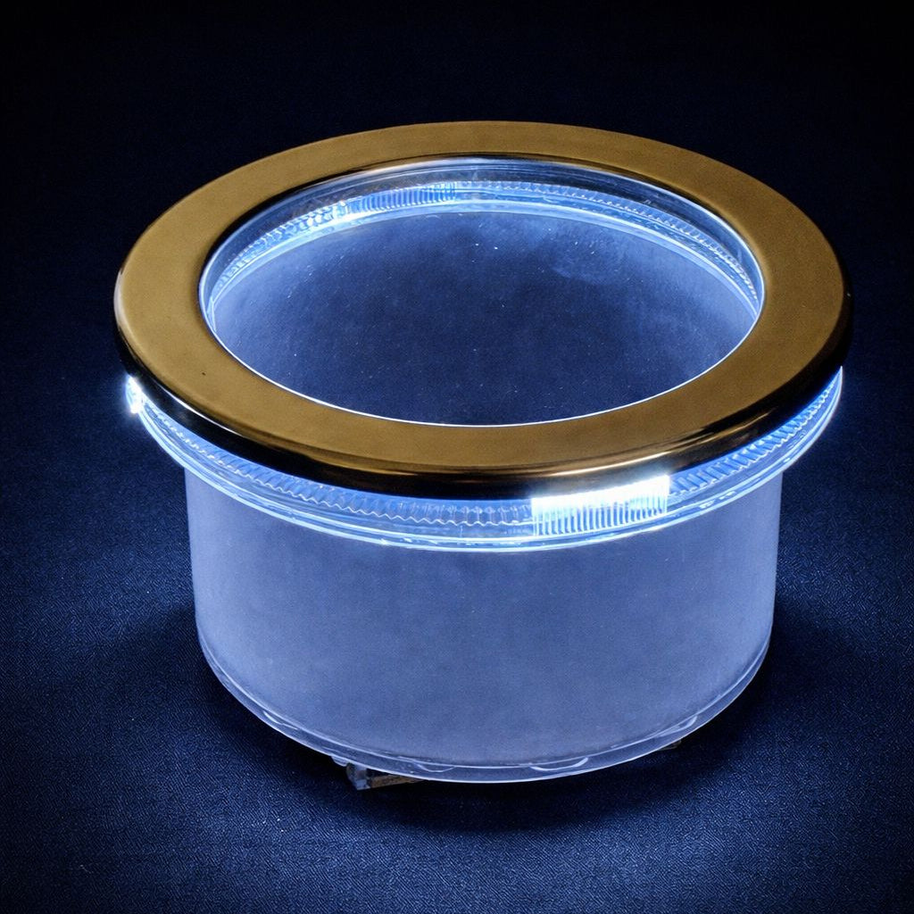 Stainless steel lighted cup holder insert with white LED ring illuminated against black background
