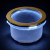Stainless steel lighted cup holder insert with white LED ring illuminated against black background
