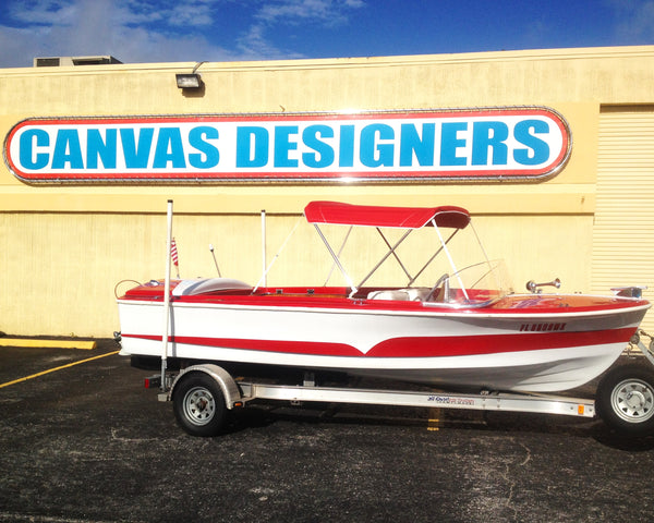 canvas designers sign and red bay boat with custom marine upholstery 
